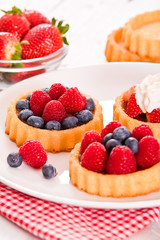 Tartlets with forest fruits. 