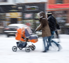 Fototapeta premium Mother with small child in the stroller