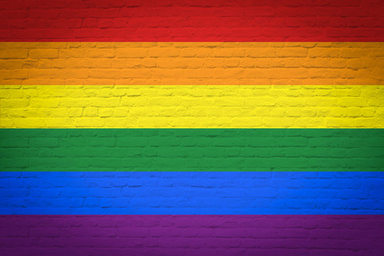 Brick wall with rainbow flag