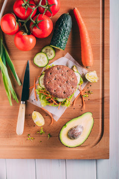 Vegetarian sandwich with lettuce, cucumber, carrot tomato anda avocado