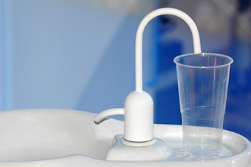 Water fountain at the dentist. Basic dentistry equipment used for the health and care of both adults and children's oral hygiene.
