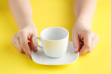 woman hand holding white cup