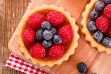 Tartlets with forest fruits. 