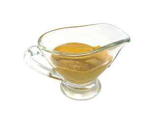 yellow mustard in a glass bowl crocery isolated on white background