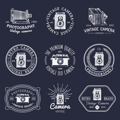 Fototapeta premium Vector set of old cameras logos. Vintage photo studio, salon signs, labels or badges.