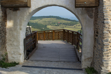 Fototapeta na wymiar Landscape seen thru gate at Deva fortress 