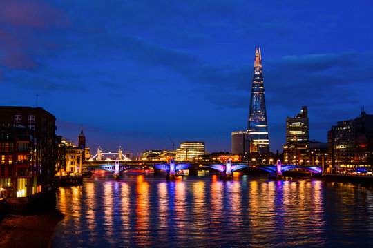 London cityscape with Southwark Bridge and The Shard skyscraper