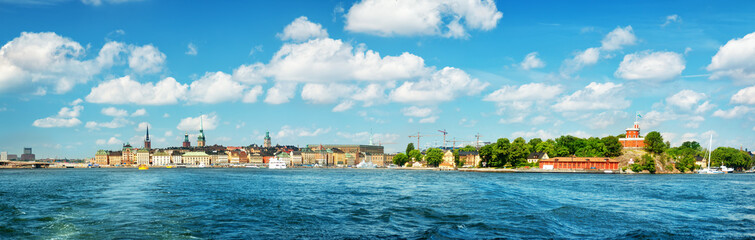 Fototapeta na wymiar View to Stockholm, Sweden with a ferry from sea in summer. Gamla Stan on sunny day