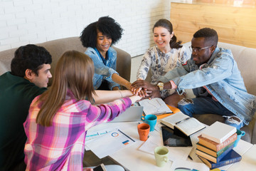 Happy young multiracial group of young university students studying