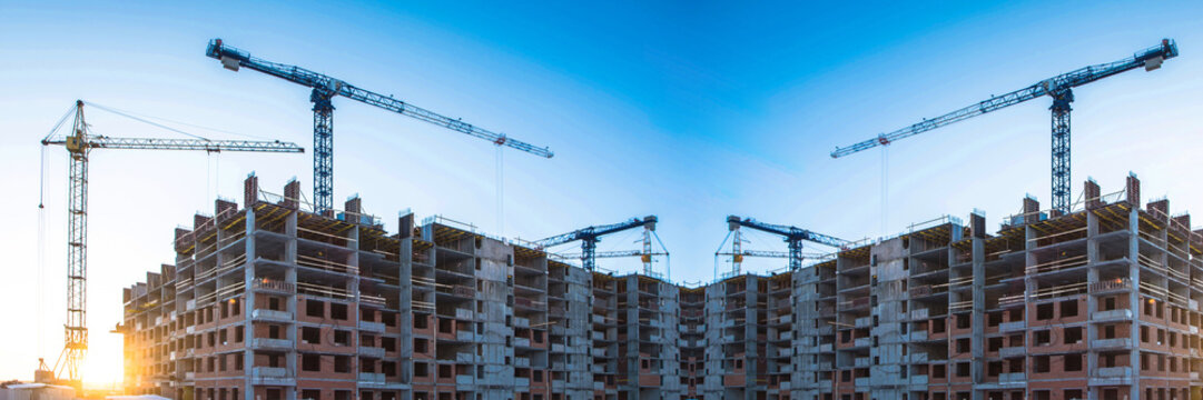 Panorama of construction at the background of blue sky