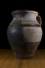 Ceramic pot isolated on wood table