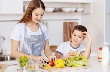 Positive siblings cooking in the kitchen together