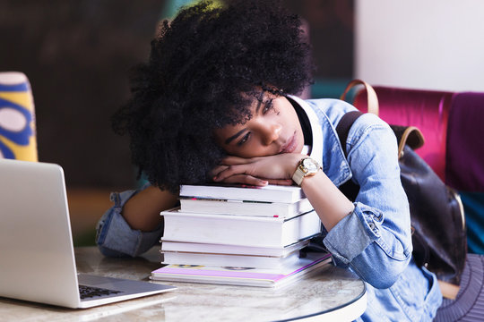 Young African American Woman Student Tired Of Working And Studying