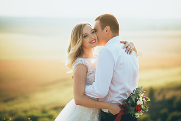 Wedding couple hugging each other