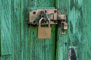 Old lock on a weathered door. Texture background.