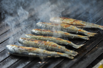 detail shot of some fish on a grill.