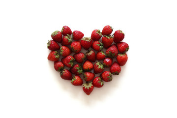 A heart from strawberry on the white background.