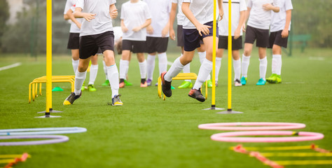 Soccer Skills Training Session. Players Training on the Field. Soccer Obstacle Course. Grass...