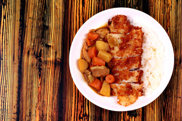 Rice with deep fried dolly fish in japanese yellow curry.