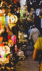 Old medina souk market in Marrakesh. Path with colourful lamps