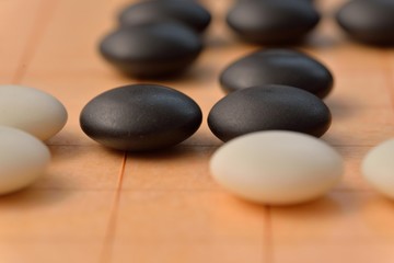 Fototapeta na wymiar GO game. GO is an abstract strategy board game for two players, in which the aim is to surround more territory than the opponent.