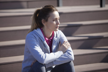 Morning exercise along the river. A young woman on recreation and jogging