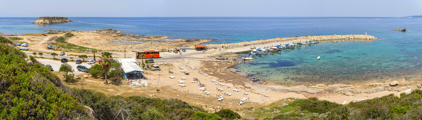 Panoramic view on marina with tied yachts and cars on parking. Cape Drepano, Cyprus. 