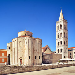 Fototapeta premium Church st. Donat in Zadar, Croatia - Crkva Sv. Donata u Zadru. Zadar Cathedral in the background - Katedrala sv. Stošije. The church with blue sky in summer.