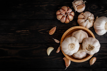 garlic ingredient on wood background top view
