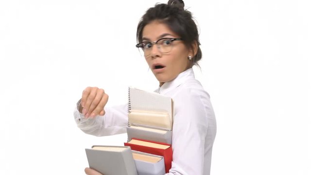 Young college female student with books is late for class isolated