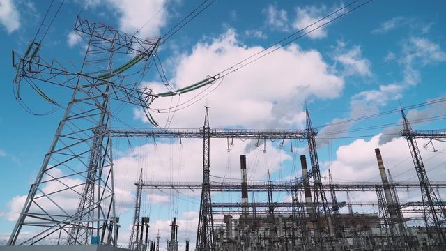 CHP industry. View of the power station, smoke comes from pipes. 4k footage.

