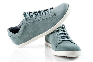 Pair of man's shoes front view. Suede sneakers isolated on white background.