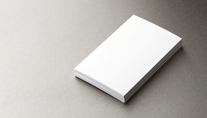 Top view of business card over gray background. Horizontal shoot.