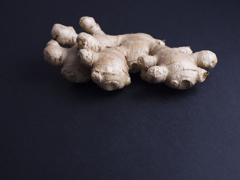 Fresh Ginger Root Isolated On Black Background