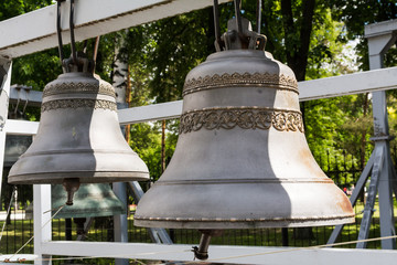 Obraz premium Large ancient brass bells close up. Exhibition of antique church bells in Yaroslavl, Russia