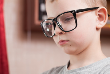 Little boy in big glasses,