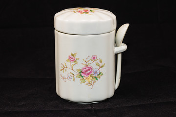 jar for storing tea or sugar (five and a half inches tall, 3 and a half wide)