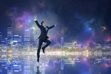 Naklejka premium Businessman celebrating success. Mixed media . Mixed media