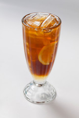 Fototapeta na wymiar cold tea with lemon and ice in the glass.