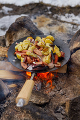 frying food on an open fire