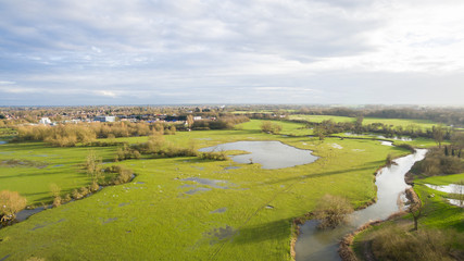 Fototapeta na wymiar Aerial view of a lake and river area in the countryside late afternoon in the winter