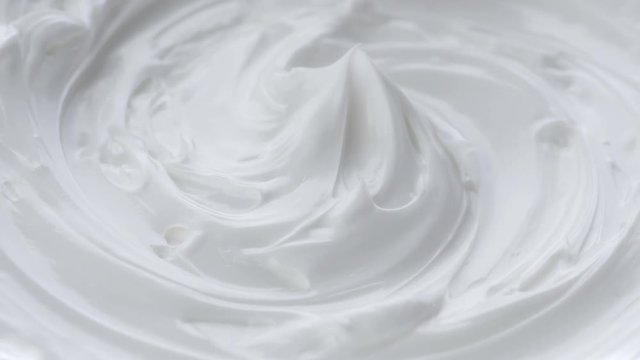 White gentle cosmetic cream. Cosmetics cream with rotate. Close-up shot.
