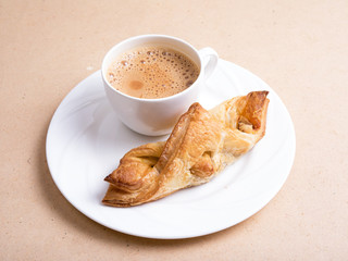 crispy chicken puffs with tea served in a white plate