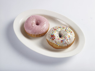 strawberry and vanilla cream glazed Doughnut with sprinkles candy