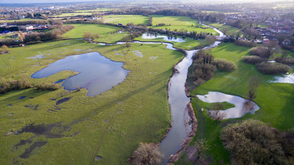 Aerial view of a lake and river in the countryside
