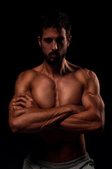 Fototapeta na wymiar Young muscular man showing his muscles