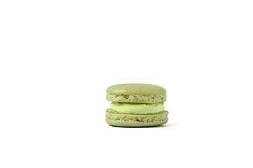 Tasty green macaron isolated on white
