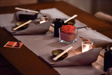 Table set by candlelight in a Japanese restaurant