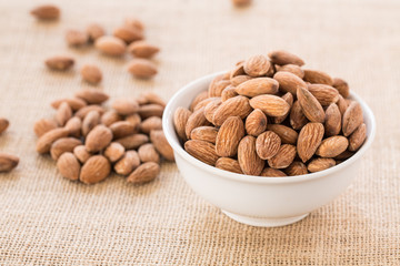 White Bowl With Almonds On Burlap