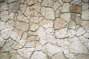 Stone wall background.Vignette effect.
